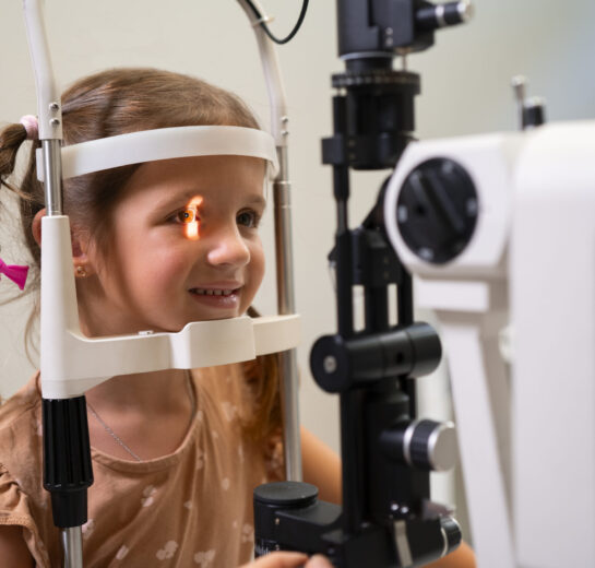 medium-shot-girl-getting-her-eyes-checked